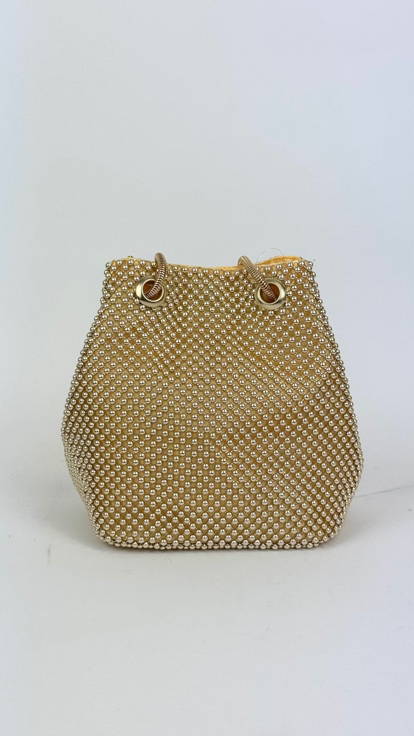 Mala bucket com bolinhas douradas