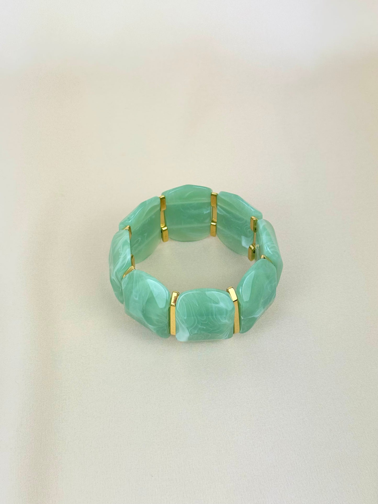 Pulseira elástica em acrílico verde-água