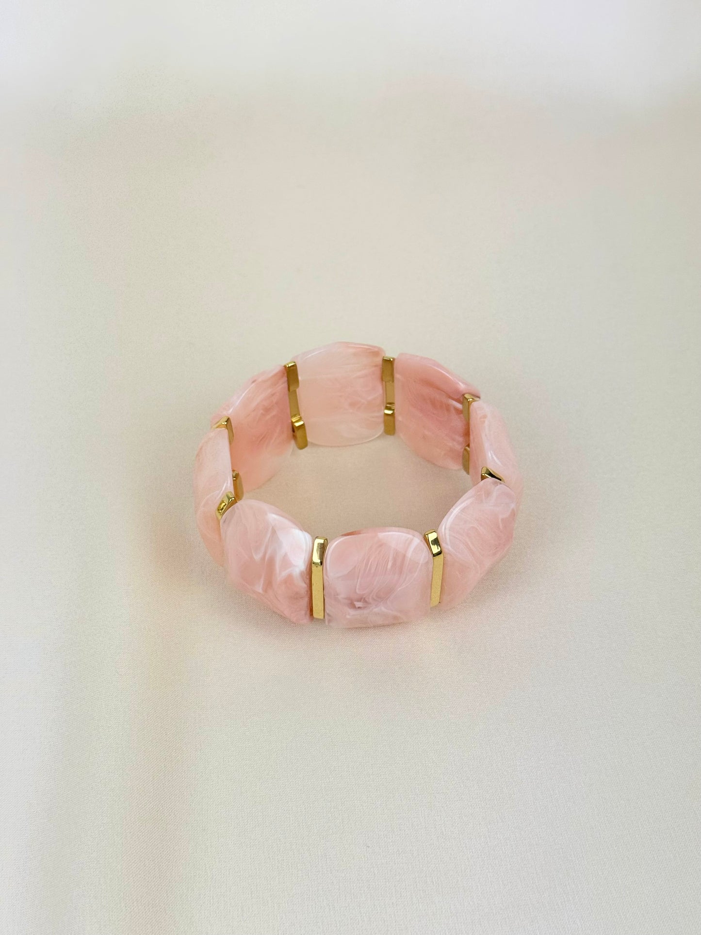 Pulseira elástica em acrílico rosa