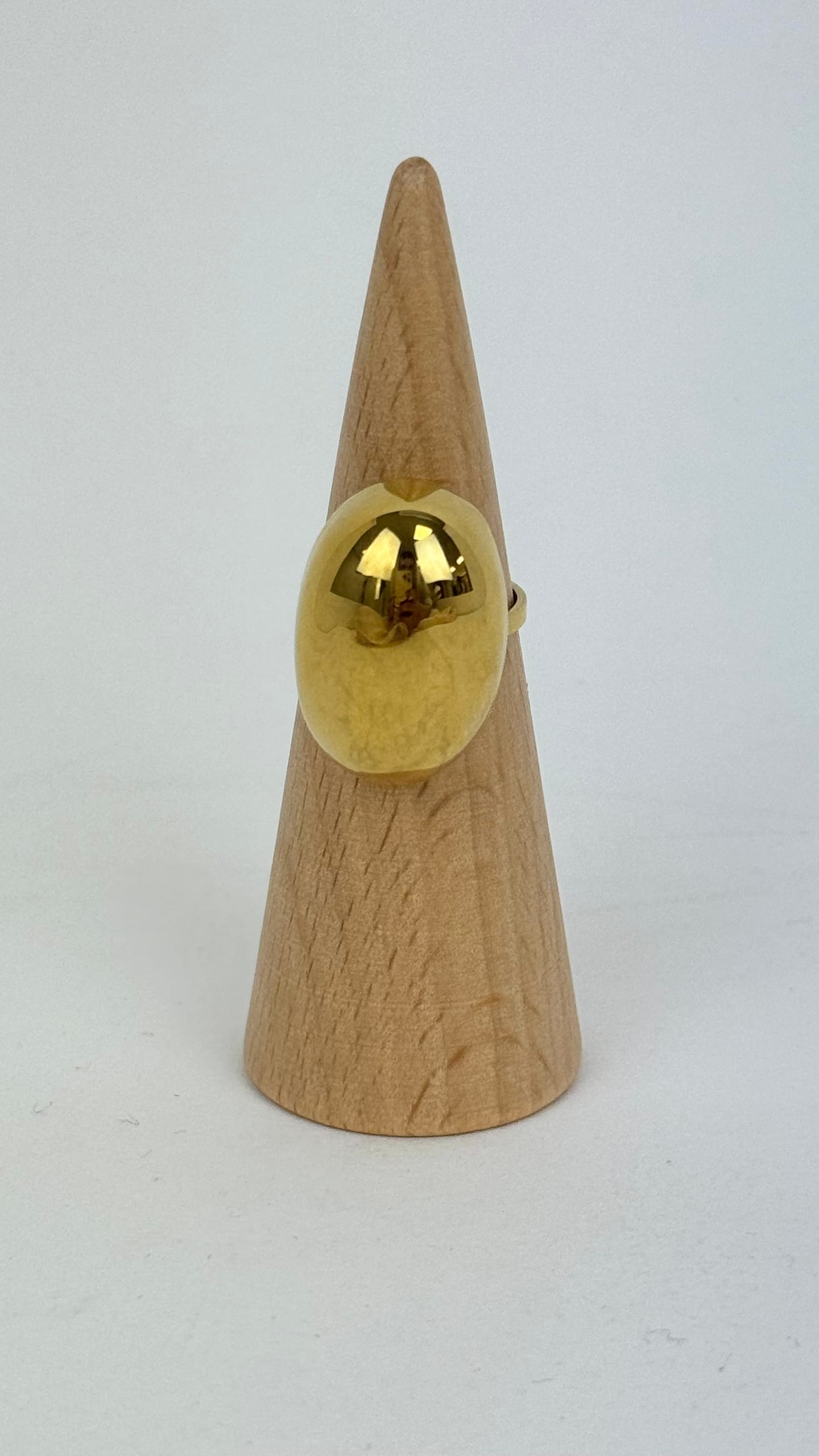 Anel aço dourado efeito oval