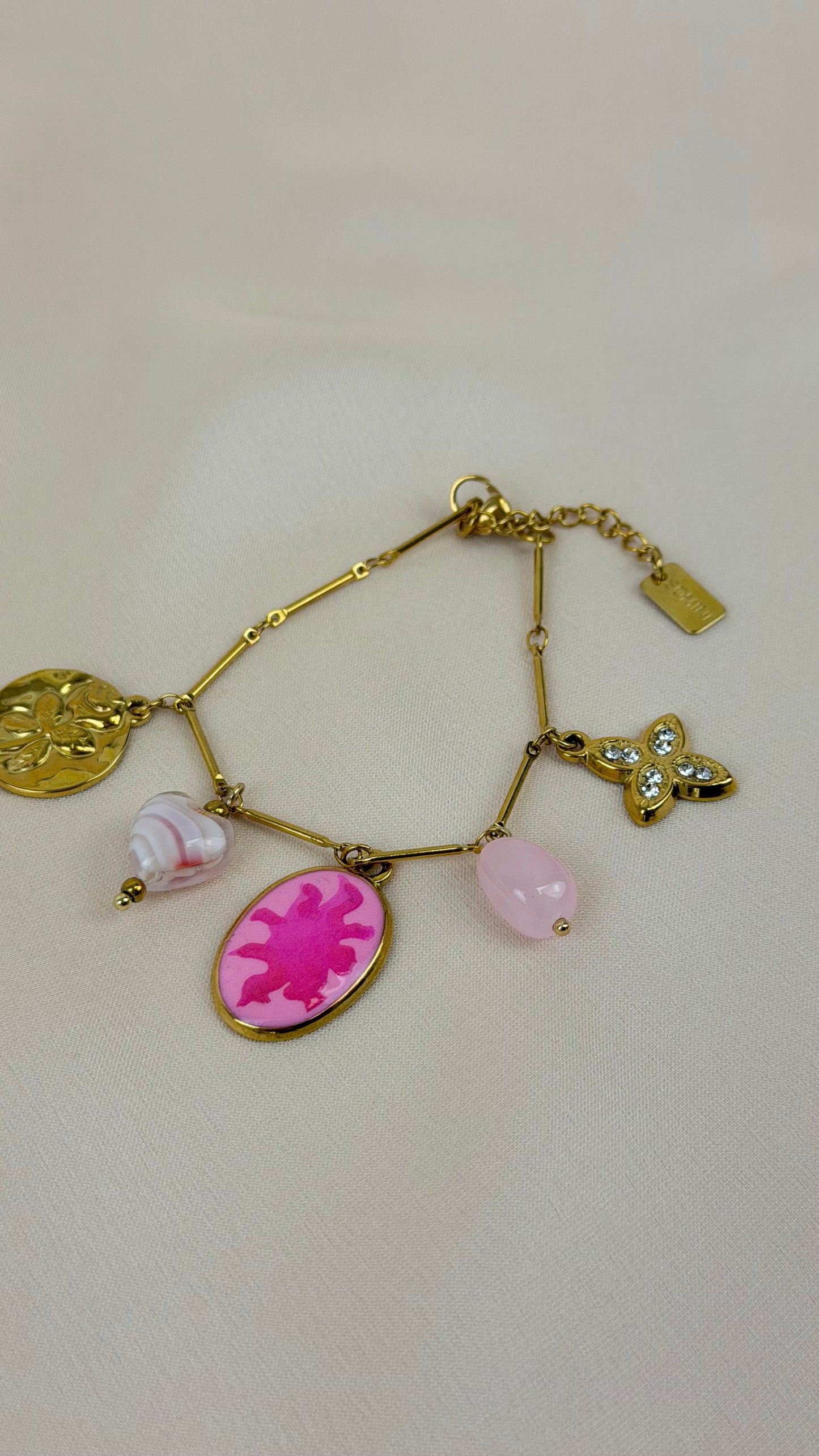 Pulseira aço dourado pendentes rosa