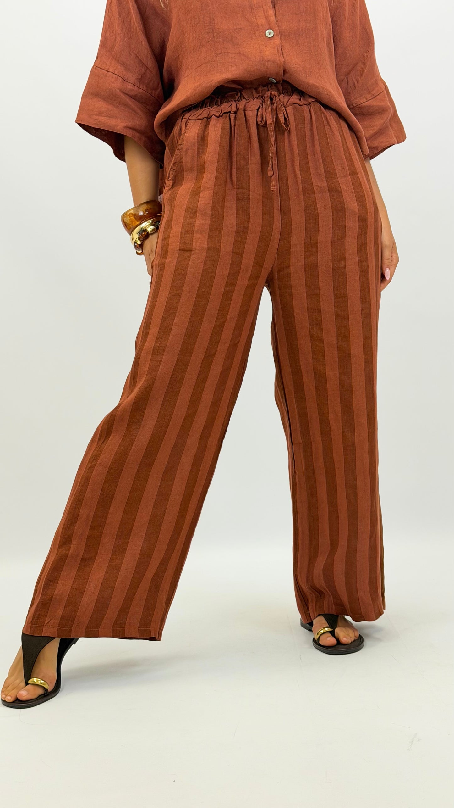 Calça linho risca tons telha