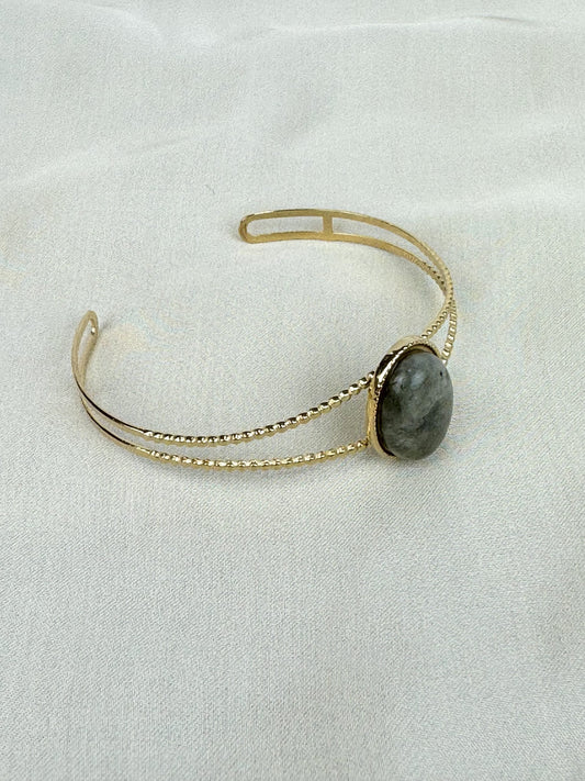 Escrava aço dourado com pedra verde