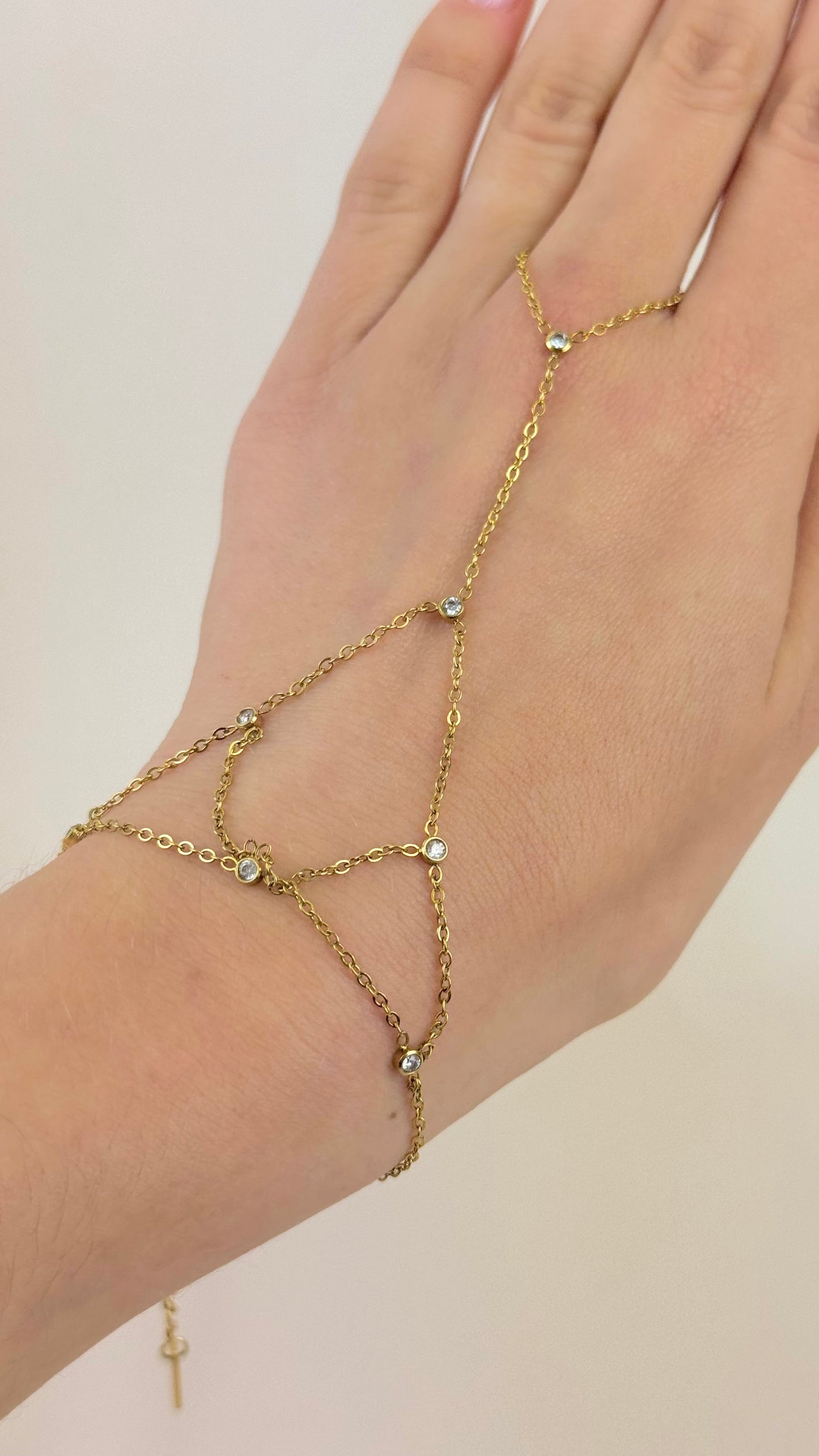 Anel/pulseira aço dourado entrelaçado com brilhantes