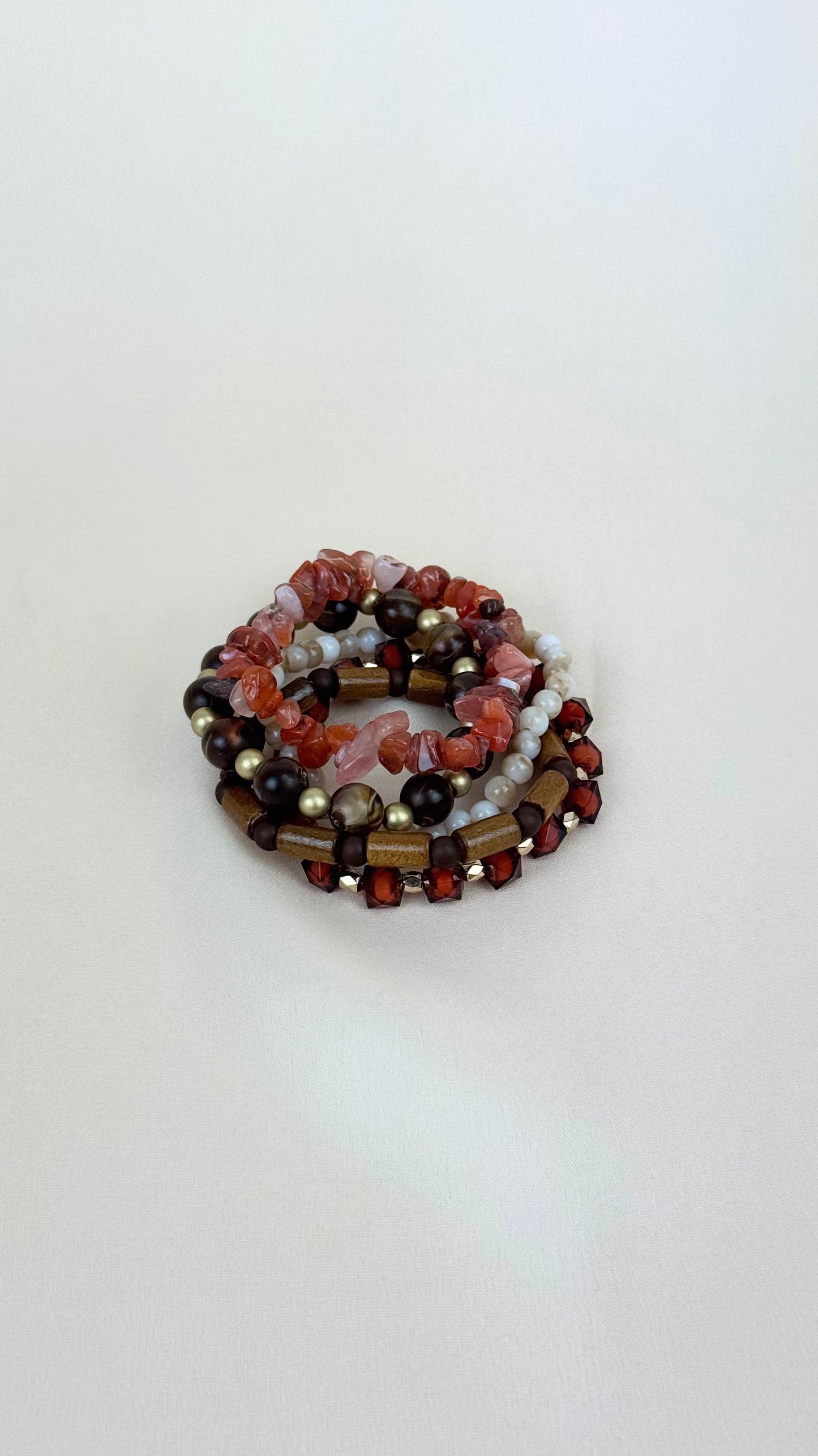 Conjunto pulseiras elásticas tons telha e castanho