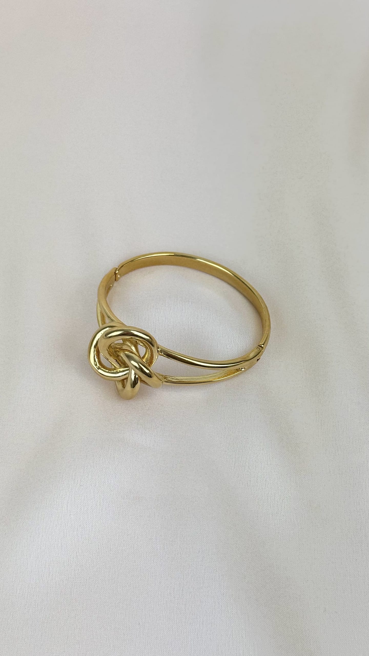 Pulseira aço dourado efeito nó