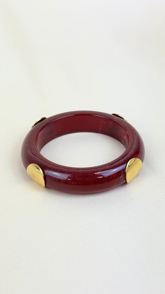 Pulseira acrilico bordeaux com aço dourado