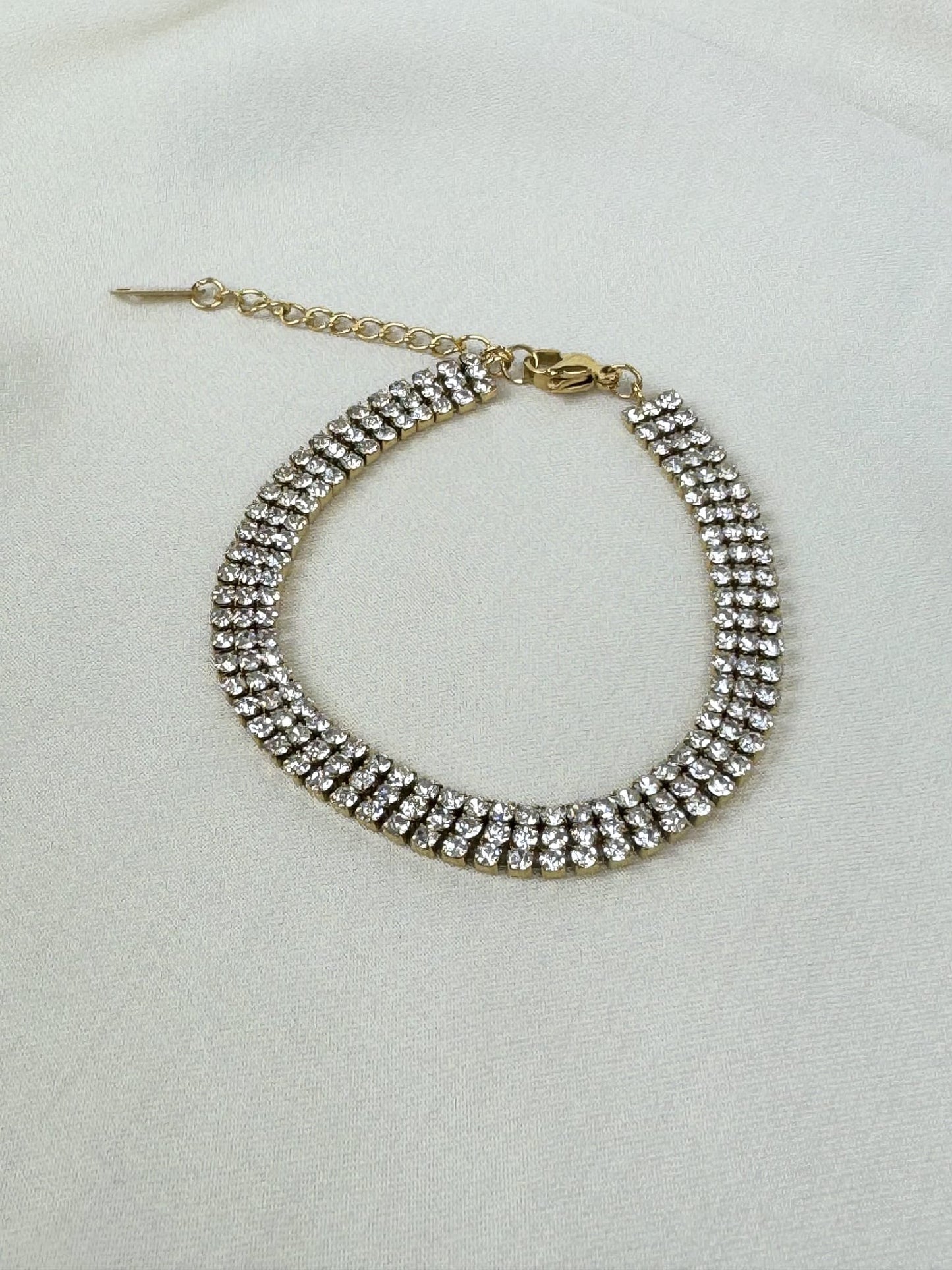 Pulseira aço dourado com brilhantes